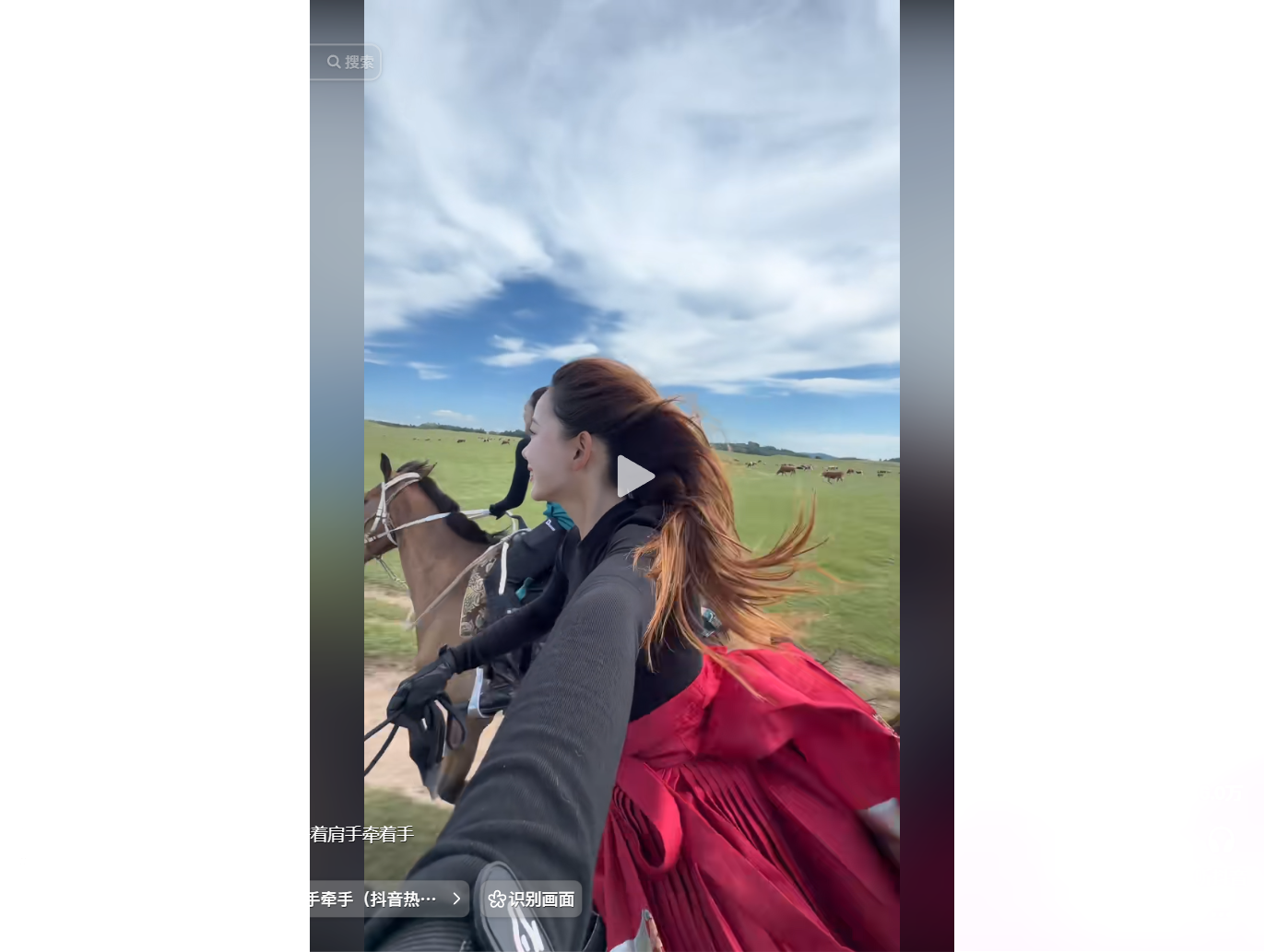 A woman in a red dress rides a horse across a gree